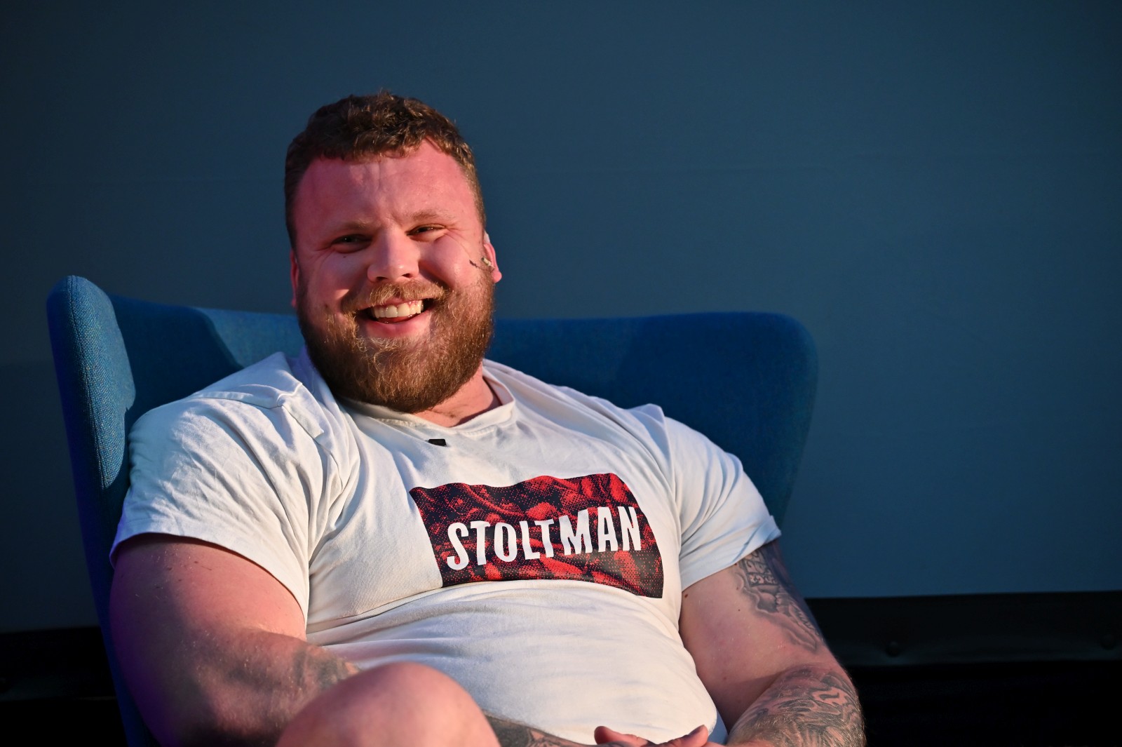 Tom Stoltman sitting on chair