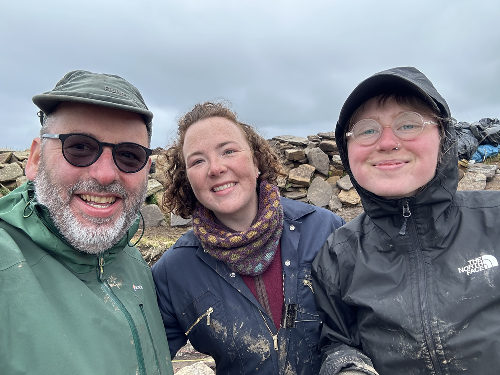 Three Archaeology students working outdoors in Orkney