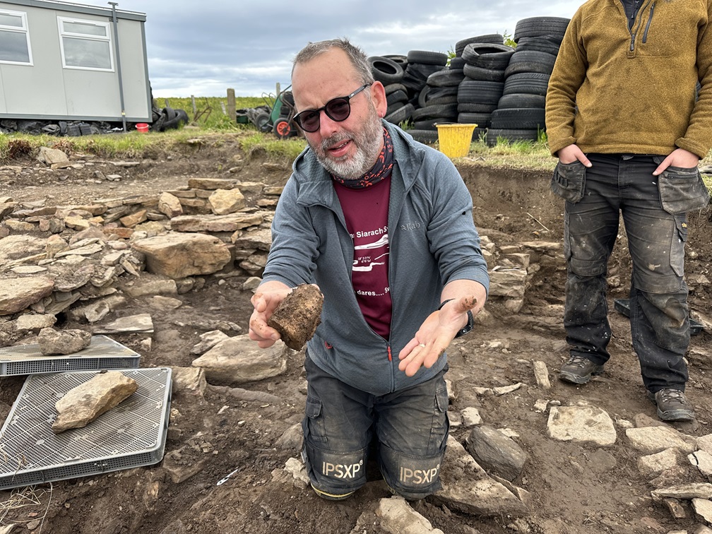 Archaeology student working outdoors in Orkney