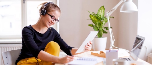 Student with headphone and laptop