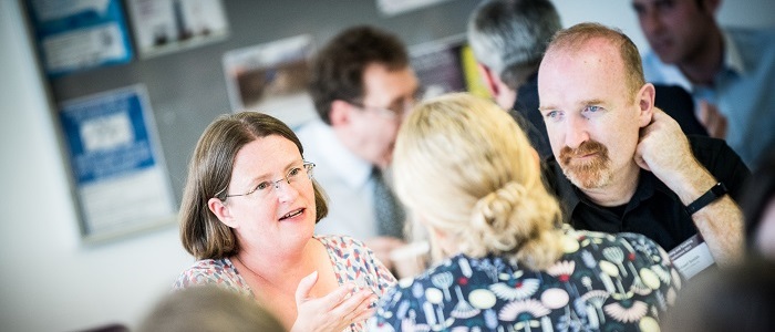 People talking at a conference