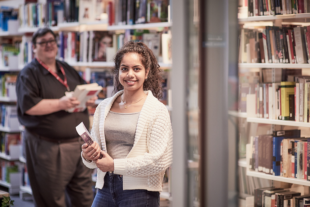 Two people in a library