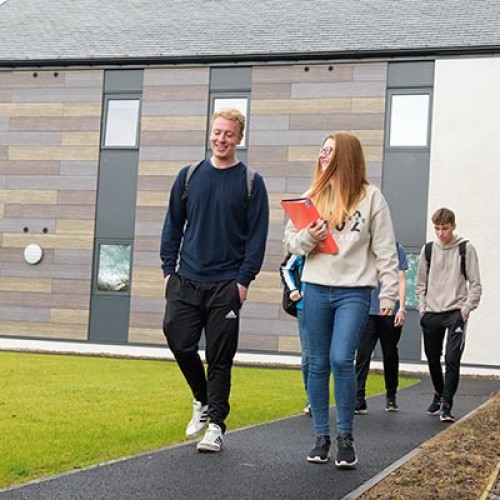 Students walking outside accommodation