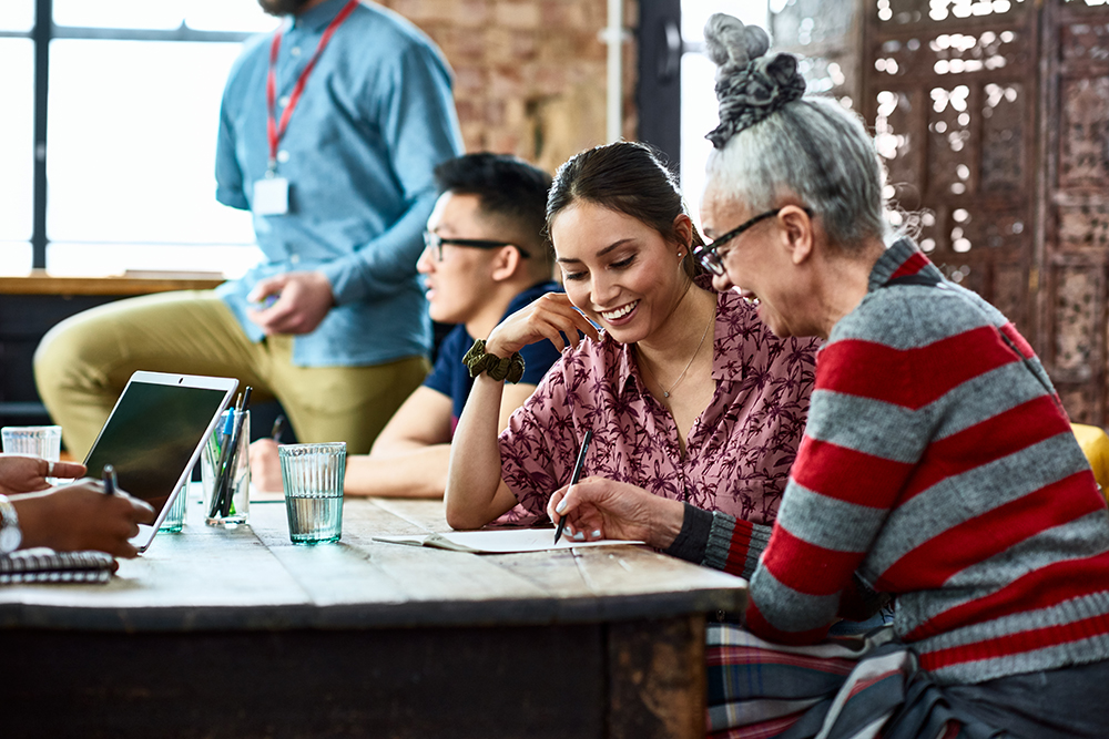 A group of people at a table discussing