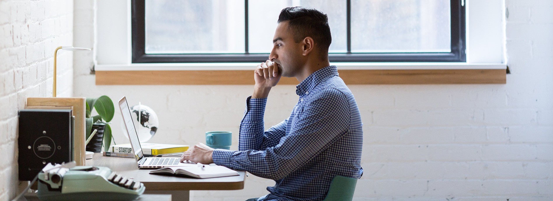 Person using a laptop at a desk