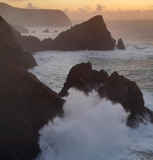 Cliffs on a sea front with crashing waves