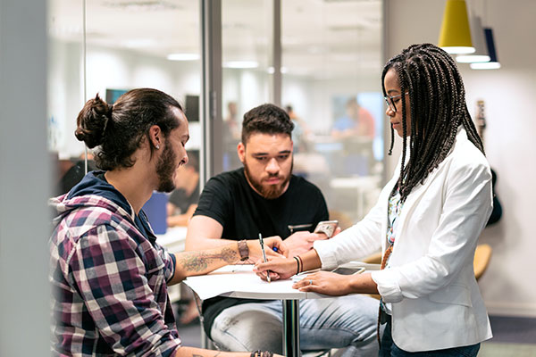 A group of young entrepreneurs collaborating in a workspace